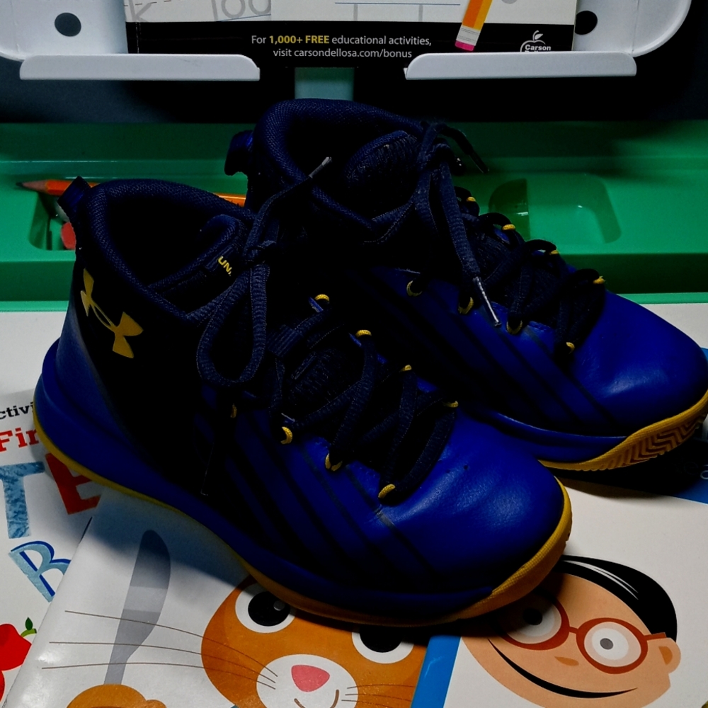 Royal blue, navy, and yellow toddler boy Under Armour sneakers